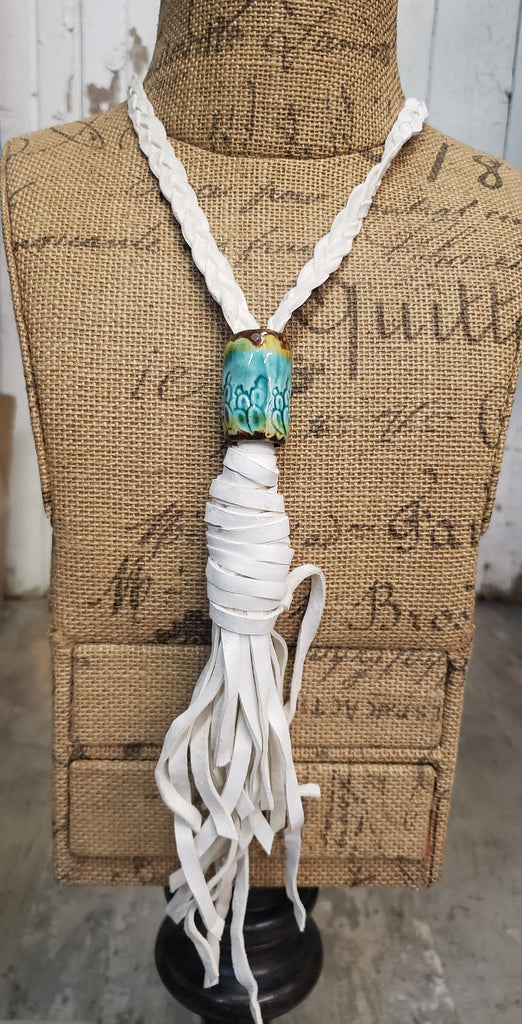 BRAIDED LEATHER WITH POTTERY